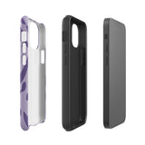 The Luna Morada for iPhone by Statement Cases is a durable phone case with a purple protective exterior featuring abstract dark purple and lavender patterns. The design includes geometric shapes and curves, giving it a modern artistic look. Made from impact-resistant polycarbonate, the lower part of the case prominently displays "STATEMENT CASES.