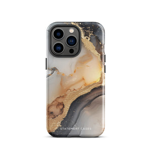 A smartphone with a sleek, marbled design case featuring swirls of gold, beige, and dark grey colors. The camera lenses on the back of the iPhone 15 Pro Max are clearly visible, and the protective Lunar & Gold Marble for iPhone case is branded with "Statement Cases" at the bottom.