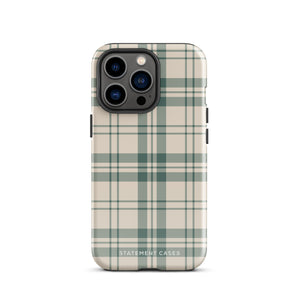 A smartphone with a beige and green plaid-patterned, impact-resistant polycarbonate case is shown. The phone’s rear camera lenses are prominently visible at the top left. The durable phone case features the words “Statement Cases” printed in small text at the bottom center. This is the Elegant Plaid for iPhone.