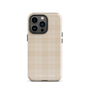 A smartphone with a plaid design case is displayed. The durable phone case features a beige and light brown checked pattern. The phone's camera lenses are visible at the top left corner. With dual-layer protection, the bottom of the impact-resistant polycarbonate Sophisticated Plaid for iPhone case reads "Statement Cases" in white.