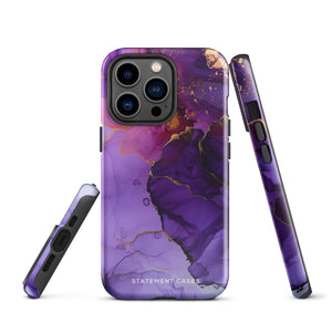 A Statement Cases Golden Orchid Marble for iPhone with a case featuring an abstract design of swirling purple, pink, and gold hues over a white background. The marbled patterns with metallic accents provide dual-layer protection and are impact-resistant. The top of the case has cutouts for the phone's camera lenses and is induction charging compatible.