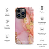 The Gold Blush Marble for iPhone showcases a glossy, marble-patterned case in shades of pink and gold. The decorative design features swirling patterns, seamlessly blending the colors. Crafted with impact-resistant polycarbonate for superior phone protection, "Statement Cases" is written in white at the bottom.