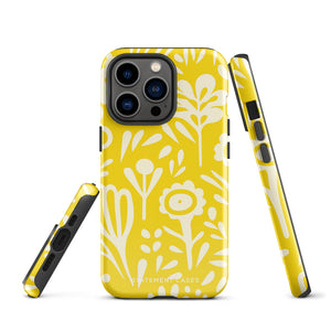 The Sol Dorado for iPhone by Statement Cases is a smartphone with a yellow case featuring a white, abstract floral and plant pattern. The camera lenses are prominent in the top left corner of the device. With dual-layer protection and impact-resistant TPU lining, "Statement Cases" is printed at the bottom of the case.