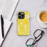 The Sol Dorado for iPhone by Statement Cases is a smartphone with a yellow case featuring a white, abstract floral and plant pattern. The camera lenses are prominent in the top left corner of the device. With dual-layer protection and impact-resistant TPU lining, "Statement Cases" is printed at the bottom of the case.