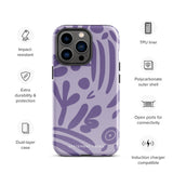 The Luna Morada for iPhone by Statement Cases is a durable phone case with a purple protective exterior featuring abstract dark purple and lavender patterns. The design includes geometric shapes and curves, giving it a modern artistic look. Made from impact-resistant polycarbonate, the lower part of the case prominently displays "STATEMENT CASES.