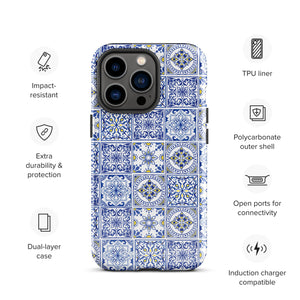 The Lisboa Azul for iPhone by Statement Cases is a smartphone adorned with a dual-layer protection phone case, featuring an intricate blue and white tile pattern. The design showcases various geometric and floral motifs, forming a visually appealing mosaic effect. The impact-resistant camera lenses and flash are prominently visible at the top left.