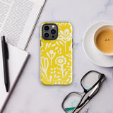 The Sol Dorado for iPhone by Statement Cases is a smartphone with a yellow case featuring a white, abstract floral and plant pattern. The camera lenses are prominent in the top left corner of the device. With dual-layer protection and impact-resistant TPU lining, "Statement Cases" is printed at the bottom of the case.