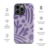 The Luna Morada for iPhone by Statement Cases is a durable phone case with a purple protective exterior featuring abstract dark purple and lavender patterns. The design includes geometric shapes and curves, giving it a modern artistic look. Made from impact-resistant polycarbonate, the lower part of the case prominently displays "STATEMENT CASES.