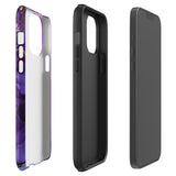 A Statement Cases Golden Orchid Marble for iPhone with a case featuring an abstract design of swirling purple, pink, and gold hues over a white background. The marbled patterns with metallic accents provide dual-layer protection and are impact-resistant. The top of the case has cutouts for the phone's camera lenses and is induction charging compatible.