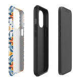 Statement Cases' Mediterranean Bloom for iPhone is showcased, featuring an intricate, colorful pattern. The design includes blue, yellow, and orange floral shapes in a symmetrical arrangement on a light blue background. This durable phone case provides dual-layer protection and is constructed from impact-resistant polycarbonate to safeguard your device.