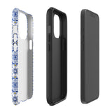 The Lisboa Azul for iPhone by Statement Cases is a smartphone adorned with a dual-layer protection phone case, featuring an intricate blue and white tile pattern. The design showcases various geometric and floral motifs, forming a visually appealing mosaic effect. The impact-resistant camera lenses and flash are prominently visible at the top left.