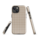 A smartphone with a brown and beige houndstooth-patterned case is shown from the back. The impact-resistant, dual-layered Classic Houndstooth for iPhone by Statement Cases protects the phone's body and leaves openings for the camera lenses and flash. The hues give the case a stylish and sophisticated appearance.