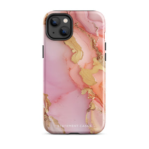 The Gold Blush Marble for iPhone showcases a glossy, marble-patterned case in shades of pink and gold. The decorative design features swirling patterns, seamlessly blending the colors. Crafted with impact-resistant polycarbonate for superior phone protection, "Statement Cases" is written in white at the bottom.