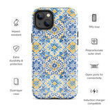 The Blue Mirage for iPhone by Statement Cases features a dual-layered, impact-resistant polycarbonate exterior with a TPU inner liner. Inspired by traditional Portuguese tiles, the blue and yellow patterned case boasts an intricate design of floral and geometric motifs. With its elegant and colorful appearance, the phone's camera is visible at the top left of the case.