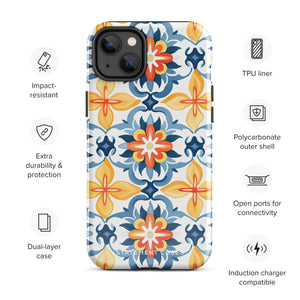 Statement Cases' Mediterranean Bloom for iPhone is showcased, featuring an intricate, colorful pattern. The design includes blue, yellow, and orange floral shapes in a symmetrical arrangement on a light blue background. This durable phone case provides dual-layer protection and is constructed from impact-resistant polycarbonate to safeguard your device.