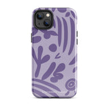 The Luna Morada for iPhone by Statement Cases is a durable phone case with a purple protective exterior featuring abstract dark purple and lavender patterns. The design includes geometric shapes and curves, giving it a modern artistic look. Made from impact-resistant polycarbonate, the lower part of the case prominently displays "STATEMENT CASES.