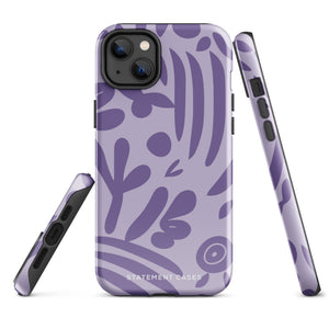 The Luna Morada for iPhone by Statement Cases is a durable phone case with a purple protective exterior featuring abstract dark purple and lavender patterns. The design includes geometric shapes and curves, giving it a modern artistic look. Made from impact-resistant polycarbonate, the lower part of the case prominently displays "STATEMENT CASES.