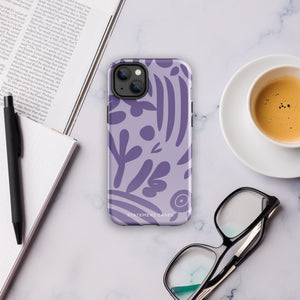 The Luna Morada for iPhone by Statement Cases is a durable phone case with a purple protective exterior featuring abstract dark purple and lavender patterns. The design includes geometric shapes and curves, giving it a modern artistic look. Made from impact-resistant polycarbonate, the lower part of the case prominently displays "STATEMENT CASES.