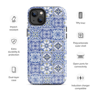 The Lisboa Azul for iPhone by Statement Cases is a smartphone adorned with a dual-layer protection phone case, featuring an intricate blue and white tile pattern. The design showcases various geometric and floral motifs, forming a visually appealing mosaic effect. The impact-resistant camera lenses and flash are prominently visible at the top left.