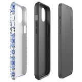 The Lisboa Azul for iPhone by Statement Cases is a smartphone adorned with a dual-layer protection phone case, featuring an intricate blue and white tile pattern. The design showcases various geometric and floral motifs, forming a visually appealing mosaic effect. The impact-resistant camera lenses and flash are prominently visible at the top left.