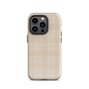 A smartphone with a plaid design case is displayed. The durable phone case features a beige and light brown checked pattern. The phone's camera lenses are visible at the top left corner. With dual-layer protection, the bottom of the impact-resistant polycarbonate Sophisticated Plaid for iPhone case reads "Statement Cases" in white.