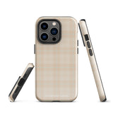 A smartphone with a plaid design case is displayed. The durable phone case features a beige and light brown checked pattern. The phone's camera lenses are visible at the top left corner. With dual-layer protection, the bottom of the impact-resistant polycarbonate Sophisticated Plaid for iPhone case reads "Statement Cases" in white.