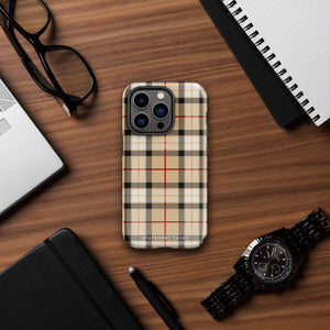 A Neutral Heritage Tartan for iPhone by Statement Cases with a plaid-patterned, impact-resistant polycarbonate case featuring beige, black, white, and red stripes. The durable phone case has the text "STATEMENT CASES" written at the bottom. The phone boasts a triple camera setup with an additional sensor and flash.