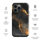A protective iPhone case with a black and gold abstract marble design. "Statement Cases" is printed in white at the bottom. The camera module of the iPhone 15 Pro Max is visible, highlighting the triple lens setup. This is the Midnight Volcano Marble for iPhone by Statement Cases.