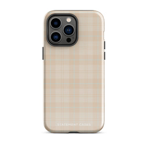 A smartphone with a plaid design case is displayed. The durable phone case features a beige and light brown checked pattern. The phone's camera lenses are visible at the top left corner. With dual-layer protection, the bottom of the impact-resistant polycarbonate Sophisticated Plaid for iPhone case reads "Statement Cases" in white.