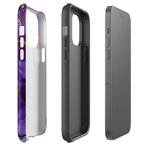 A Statement Cases Golden Orchid Marble for iPhone with a case featuring an abstract design of swirling purple, pink, and gold hues over a white background. The marbled patterns with metallic accents provide dual-layer protection and are impact-resistant. The top of the case has cutouts for the phone's camera lenses and is induction charging compatible.