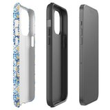 The Blue Mirage for iPhone by Statement Cases features a dual-layered, impact-resistant polycarbonate exterior with a TPU inner liner. Inspired by traditional Portuguese tiles, the blue and yellow patterned case boasts an intricate design of floral and geometric motifs. With its elegant and colorful appearance, the phone's camera is visible at the top left of the case.