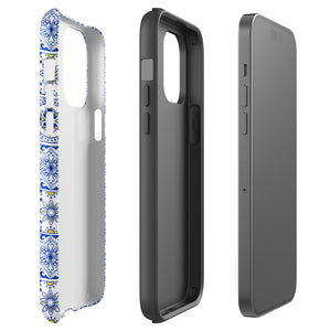 The Lisboa Azul for iPhone by Statement Cases is a smartphone adorned with a dual-layer protection phone case, featuring an intricate blue and white tile pattern. The design showcases various geometric and floral motifs, forming a visually appealing mosaic effect. The impact-resistant camera lenses and flash are prominently visible at the top left.