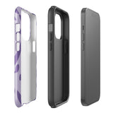 The Luna Morada for iPhone by Statement Cases is a durable phone case with a purple protective exterior featuring abstract dark purple and lavender patterns. The design includes geometric shapes and curves, giving it a modern artistic look. Made from impact-resistant polycarbonate, the lower part of the case prominently displays "STATEMENT CASES.