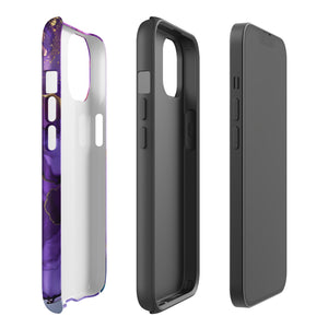 A Statement Cases Golden Orchid Marble for iPhone with a case featuring an abstract design of swirling purple, pink, and gold hues over a white background. The marbled patterns with metallic accents provide dual-layer protection and are impact-resistant. The top of the case has cutouts for the phone's camera lenses and is induction charging compatible.