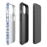 The Lisboa Azul for iPhone by Statement Cases is a smartphone adorned with a dual-layer protection phone case, featuring an intricate blue and white tile pattern. The design showcases various geometric and floral motifs, forming a visually appealing mosaic effect. The impact-resistant camera lenses and flash are prominently visible at the top left.