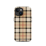 A Neutral Heritage Tartan for iPhone by Statement Cases with a plaid-patterned, impact-resistant polycarbonate case featuring beige, black, white, and red stripes. The durable phone case has the text "STATEMENT CASES" written at the bottom. The phone boasts a triple camera setup with an additional sensor and flash.