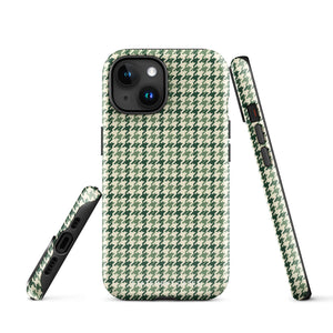 A smartphone with a durable dual-layered case featuring a green and white houndstooth pattern. The phone's camera with three lenses is visible at the top left corner. The impact-resistant polycarbonate Elegance Houndstooth for iPhone by Statement Cases, with a TPU lining, adds a stylish and classic look to the phone.