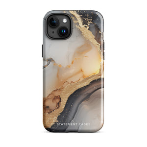 A smartphone with a sleek, marbled design case featuring swirls of gold, beige, and dark grey colors. The camera lenses on the back of the iPhone 15 Pro Max are clearly visible, and the protective Lunar & Gold Marble for iPhone case is branded with "Statement Cases" at the bottom.