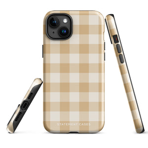 A Gingham Grace for iPhone by Statement Cases is covered with a protective case featuring a beige and white checkered pattern. The case's design includes a matte finish, dual-layer protection with an impact-resistant polycarbonate exterior and TPU lining, and the text "Statement Cases" printed near the bottom. The phone's cameras and buttons are visible.