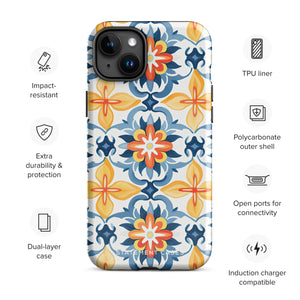 Statement Cases' Mediterranean Bloom for iPhone is showcased, featuring an intricate, colorful pattern. The design includes blue, yellow, and orange floral shapes in a symmetrical arrangement on a light blue background. This durable phone case provides dual-layer protection and is constructed from impact-resistant polycarbonate to safeguard your device.