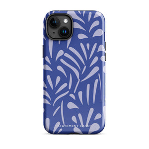 An iPhone encased in the "Mariposa Azul" by Statement Cases, featuring a blue design with an abstract white leaf pattern. The case combines curved and pointed shapes and provides dual-layer protection with TPU lining and impact-resistant polycarbonate. Camera lenses and other top elements remain unobstructed, and "Statement Cases" is inscribed at the bottom.