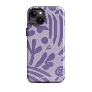 The Luna Morada for iPhone by Statement Cases is a durable phone case with a purple protective exterior featuring abstract dark purple and lavender patterns. The design includes geometric shapes and curves, giving it a modern artistic look. Made from impact-resistant polycarbonate, the lower part of the case prominently displays "STATEMENT CASES.