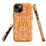 A Savannah Ardiente for iPhone from Statement Cases, featuring a dual-layered phone case in orange with a floral pattern showcasing cream-colored flowers, leaves, and geometric shapes. This impact-resistant polycarbonate case displays "STATEMENT CASES" at the bottom and reveals the camera lenses at the top left corner.