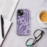 The Luna Morada for iPhone by Statement Cases is a durable phone case with a purple protective exterior featuring abstract dark purple and lavender patterns. The design includes geometric shapes and curves, giving it a modern artistic look. Made from impact-resistant polycarbonate, the lower part of the case prominently displays "STATEMENT CASES.