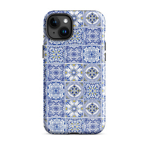 The Lisboa Azul for iPhone by Statement Cases is a smartphone adorned with a dual-layer protection phone case, featuring an intricate blue and white tile pattern. The design showcases various geometric and floral motifs, forming a visually appealing mosaic effect. The impact-resistant camera lenses and flash are prominently visible at the top left.