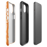 A Savannah Ardiente for iPhone from Statement Cases, featuring a dual-layered phone case in orange with a floral pattern showcasing cream-colored flowers, leaves, and geometric shapes. This impact-resistant polycarbonate case displays "STATEMENT CASES" at the bottom and reveals the camera lenses at the top left corner.