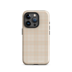 A smartphone with a plaid design case is displayed. The durable phone case features a beige and light brown checked pattern. The phone's camera lenses are visible at the top left corner. With dual-layer protection, the bottom of the impact-resistant polycarbonate Sophisticated Plaid for iPhone case reads "Statement Cases" in white.