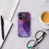 A Statement Cases Golden Orchid Marble for iPhone with a case featuring an abstract design of swirling purple, pink, and gold hues over a white background. The marbled patterns with metallic accents provide dual-layer protection and are impact-resistant. The top of the case has cutouts for the phone's camera lenses and is induction charging compatible.