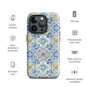 The Blue Mirage for iPhone by Statement Cases features a dual-layered, impact-resistant polycarbonate exterior with a TPU inner liner. Inspired by traditional Portuguese tiles, the blue and yellow patterned case boasts an intricate design of floral and geometric motifs. With its elegant and colorful appearance, the phone's camera is visible at the top left of the case.