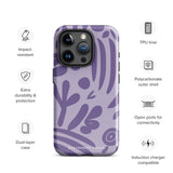 The Luna Morada for iPhone by Statement Cases is a durable phone case with a purple protective exterior featuring abstract dark purple and lavender patterns. The design includes geometric shapes and curves, giving it a modern artistic look. Made from impact-resistant polycarbonate, the lower part of the case prominently displays "STATEMENT CASES.